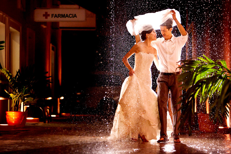 Shelter from the rain :: Destination Wedding Photography by infusedstudios.ca