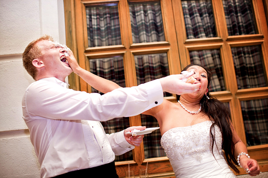 Cake fight :: Destination Wedding Photography by infusedstudios.ca