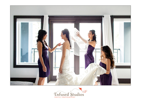 Bridesmaids helping bride get ready