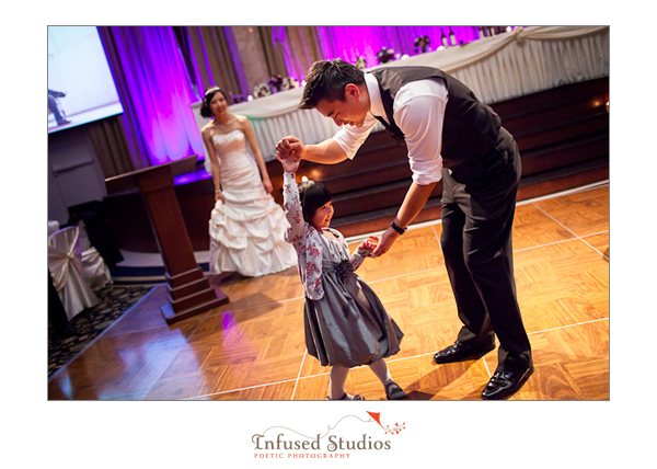 Groom dancing with little girl