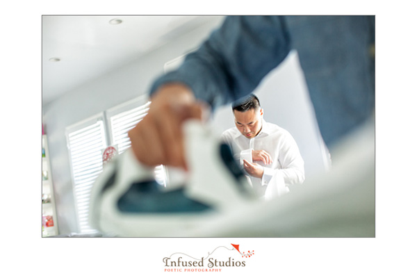 Groom getting ready by ironing