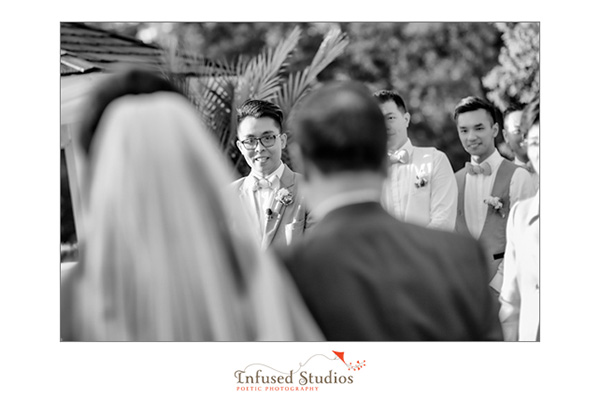 Groom's expression as bride comes down the aisle