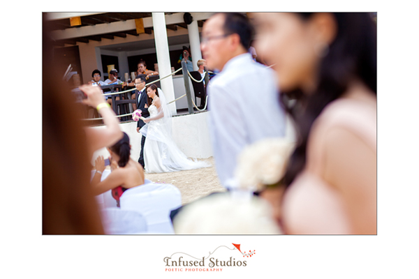 Bride and father walking down the aisle