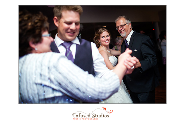 Bride and groom first dance with their parents