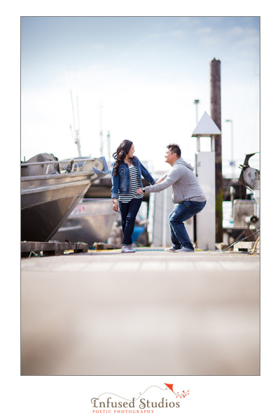 Vancouver engagement photos  - Jessica and Kevin playing on the docks