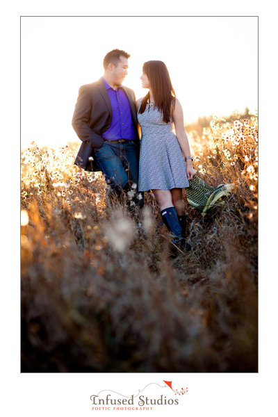 Engagement photo in a field