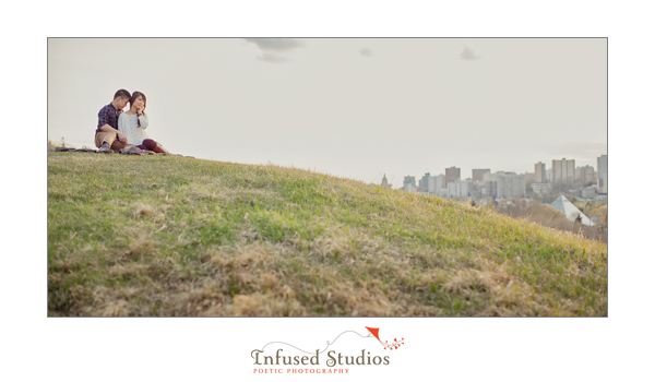 Engagement photo with city skyline