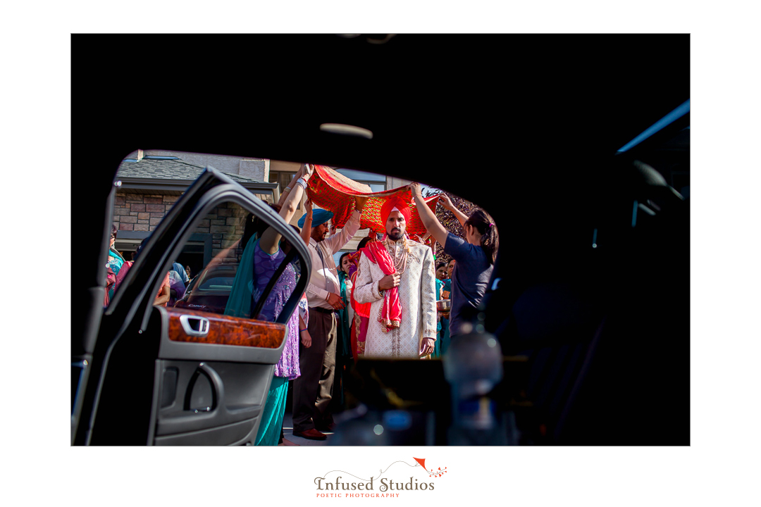 Edmonton wedding photographers :: groom framed in car doorway