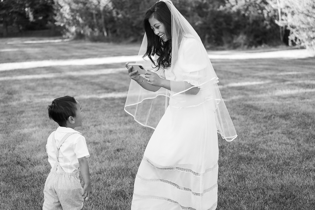 Edmonton family photo ideas - vow renewal bride taking photo of her son
