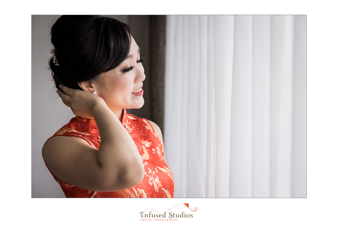 Artistic photo of bride in Chinese wedding dress by Calgary wedding photography by Infused Studios