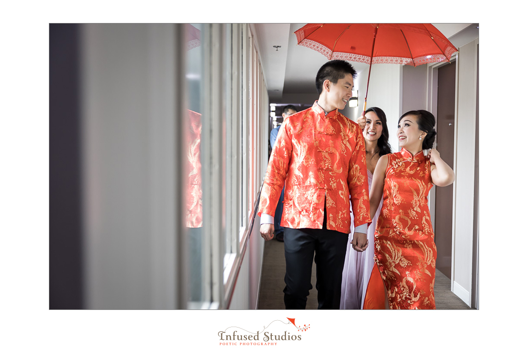Bride and groom in traditional Chinese wedding clothes by Calgary wedding photography by Infused Studios