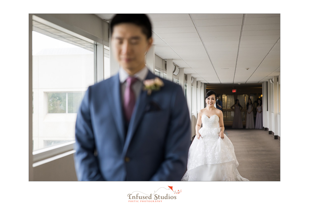 Bride approaching for first look by Calgary wedding photography by Infused Studios