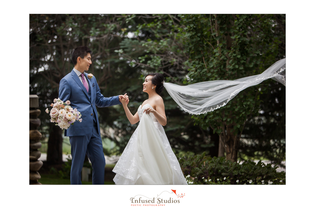 Bride & groom on wedding day bridal portrait by Calgary wedding photography by Infused Studios