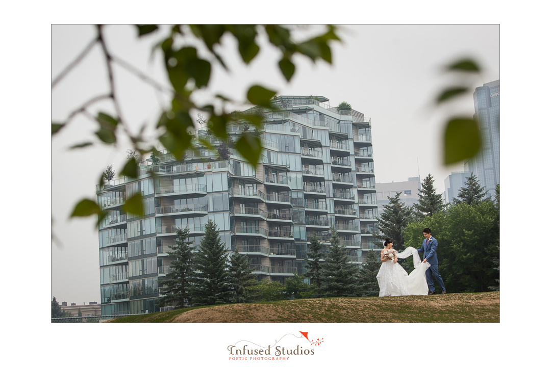 Artistic shot of bride & groom on wedding day by Calgary wedding photography by Infused Studios